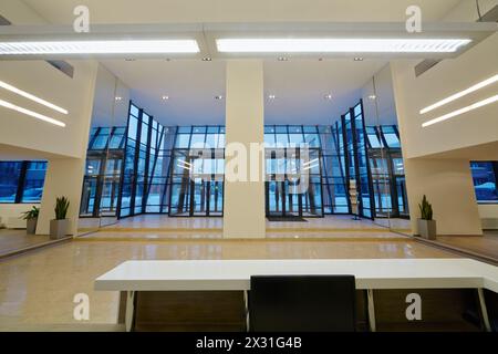 View at entrance door of office building from reception desk. Stock Photo