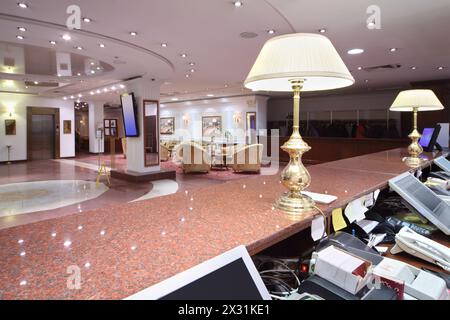 Lamps on marble counter in reception area and big lobby in modern hotel. Stock Photo