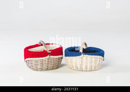 Two wicker baskets with knits inside in studio Stock Photo