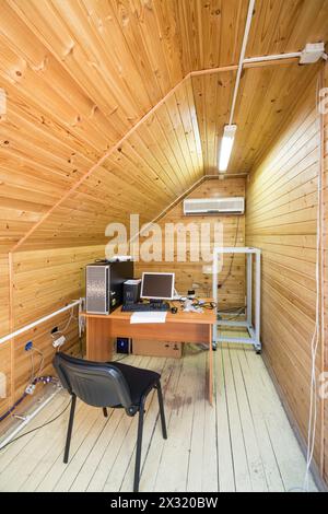 Attic room decorated tree with the server and monitor Stock Photo