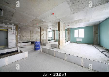 Unit in building under construction without finishing and with markings of walls. Stock Photo
