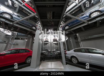 MOSCOW - JAN 11: Cars and the elevator in the tower for the presentation and storage of cars in the Volkswagen Varshavka Center on January 11, 2013, M Stock Photo