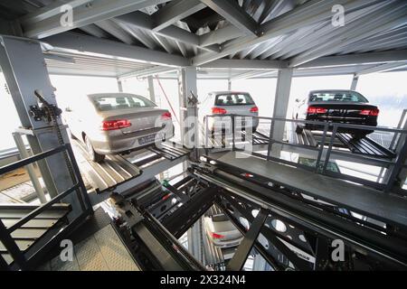 MOSCOW - JAN 11: Three vehicles on the top floor of a transparent tower for storage of cars in Varshavka Center on January 11, 2013, Moscow, Russia. T Stock Photo