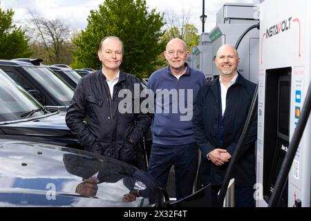 EDITORIAL USE ONLY (Left to right) Quentin Willson, motoring journalist and transport campaigner, Steve McNamara, general secretary of Licenced Taxi Drivers Association and Simon Smith, Chief Commercial Officer, InstaVolt, attends the launch of InstaVolt's largest ultra-rapid electric vehicle (EV) charging hub in London, at Syon Park in Brentford, as the UK's largest charge point operator partners with The Licensed Taxi Drivers' Association (LTDA) to call for a VAT reduction on EV public charging. Picture date: Wednesday April 24, 2024. Stock Photo