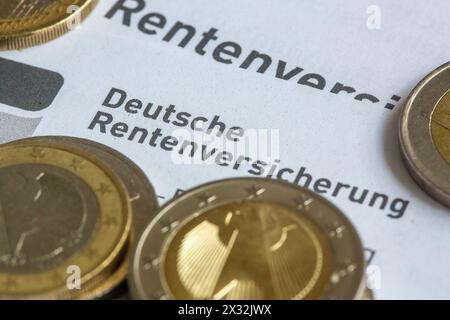 Berlin, Germany. 24th Apr, 2024. Coins lie on a pension information sheet from the German Pension Insurance. Credit: Fernando Gutierrez-Juarez/dpa/Alamy Live News Stock Photo