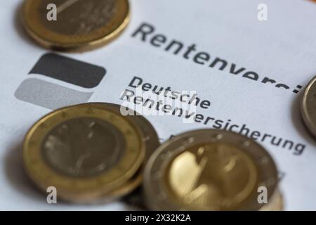 Berlin, Germany. 24th Apr, 2024. Coins lie on a pension information sheet from the German Pension Insurance. Credit: Fernando Gutierrez-Juarez/dpa/Alamy Live News Stock Photo
