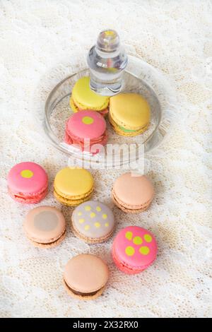 Colorful cookies with cream on table and with little glass cover Stock Photo