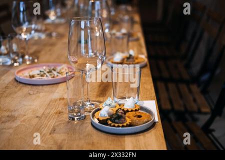 Global Cuisine Sampling Setup for a Wine Tasting Event Stock Photo - Alamy