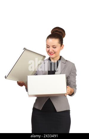 Business beautiful girl in a gray jacket opens a white box Stock Photo