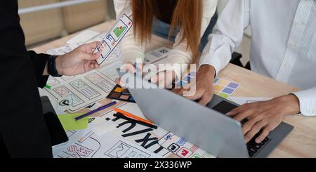 Brainstorm team of creative web graphic designer planning. Creative designers present ux ui to team. Designers team working meeting in office Stock Photo