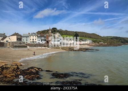 Kingsand Institute with clock tower in the centre of a coastal shot over Cawsand Bay including the beaches and countryside beyond Stock Photo
