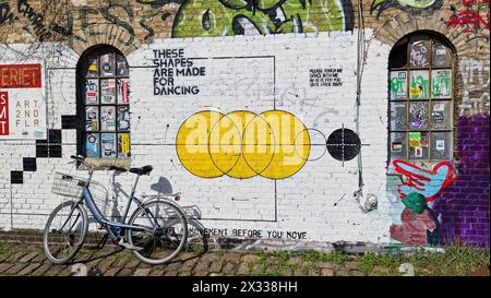 Copenhagen, Denmark - 06 Apr 2024: Dance and movement themed wall art drawing in Freetown Christiania building. Stock Photo