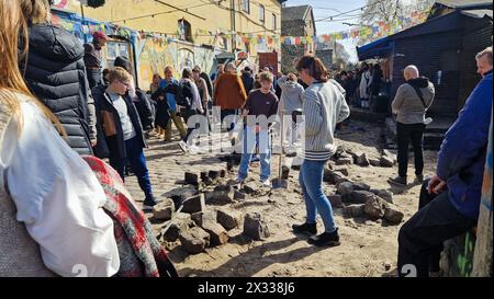 Copenhagen, Denmark - 06 Apr 2024: People are digging up cobblestones to shut down Pusher Street and fight against crime and gangs. Stock Photo