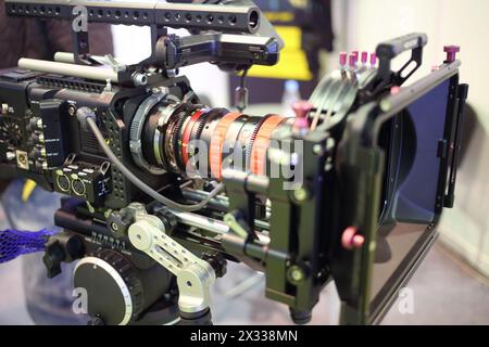MOSCOW - MAR 12, 2014: Professional digital camcorder on a tripod at the exhibition in Expo Center in Moscow, close-up Stock Photo