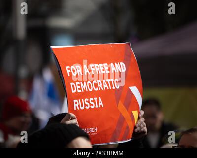 Protest sign 'For a free and democratic Russia' at a political demonstration. Anonymous people holding the message for more democracy in the country. Stock Photo