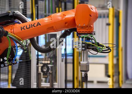 Augsburg, Bavaria, Germany - April 24, 2024: Kuka industrial robots on display in the AI research hall  Hall 43  of the University of Augsburg *** Kuka Industrieroboter ausgestellt in der KI-Forschungshalle Halle 43 der Universität Augsburg Stock Photo