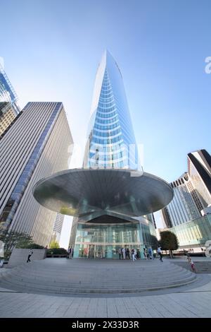 PARIS, FRANCE - SEP 12, 2014: Mirrored facade skyscraper Tour EDF in La Defense business district in Paris, view from the bottom point Stock Photo