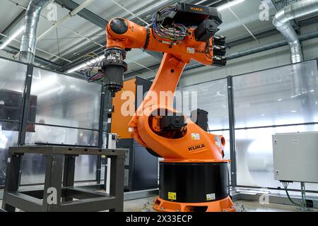 Augsburg, Bavaria, Germany - April 24, 2024: Kuka industrial robots on display in the AI research hall  Hall 43  of the University of Augsburg *** Kuka Industrieroboter ausgestellt in der KI-Forschungshalle Halle 43 der Universität Augsburg Stock Photo