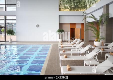 SOCHI, RUSSIA - JUL 27, 2014: Interior space with an indoor pool and loungers in the Hotel Radisson Blu Paradise Resort and Spa Stock Photo