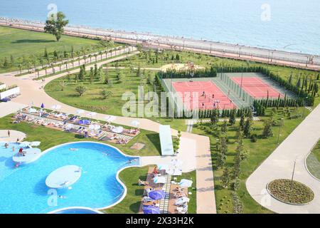 SOCHI, RUSSIA - JUL 26, 2014: Territory of the Hotel Radisson Blu Paradise Resort and Spa with swimming pool, playground and beach Stock Photo