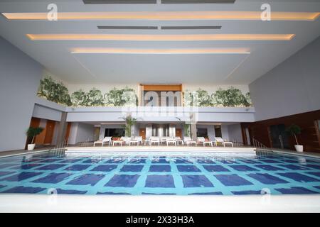 SOCHI, RUSSIA - JUL 27, 2014: Room with an indoor pool and sun loungers in the Hotel Radisson Blu Paradise Resort and Spa Stock Photo