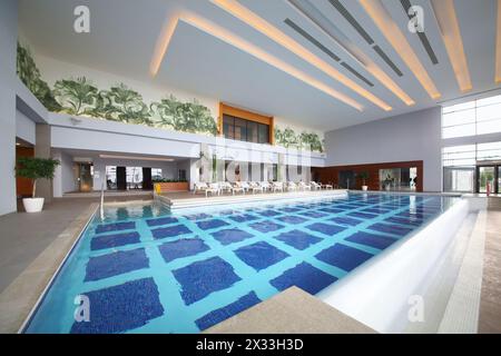 SOCHI, RUSSIA - JUL 27, 2014: Room with an indoor pool and sun loungers in the Hotel Radisson Blu Paradise Resort and Spa Stock Photo