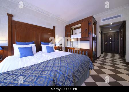 SOCHI, RUSSIA - JUL 27, 2014: Interior of superior room with a double bed and a bunk bed in the Hotel Bogatyr Stock Photo