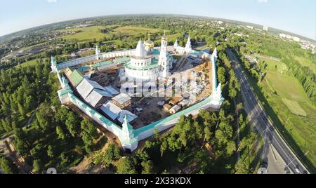 RUSSIA, MOSCOW – JUL 12, 2014: Complex of New-Jerusalem Monastery near road with traffic. Aerial view (Photo with noise from action camera) Stock Photo