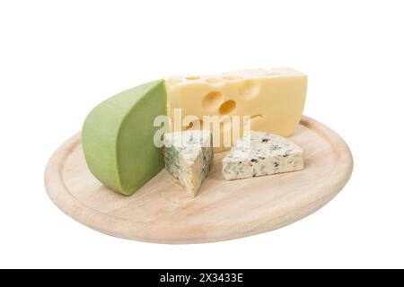A set of different cheeses on a wooden platter. Isolated over white background. Close-up. Stock Photo