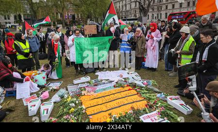 Westminster, London, UK. 24th Apr, 2024. People take part in a vigil for Palestine in Parliament Square. A list of children who have died in the Israel-Hamas conflict is read out in the otherwise silent event. Credit: Imageplotter/Alamy Live News Stock Photo