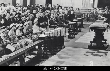 Queen Elizabeth II and the Queen Mother are shown across the aisle from President Eisenhower at St Paul's Cathedral in a photograph dated circa 1953. The ceremony was held to honor the 28,000 American soldiers who died during the Second World War, marking a poignant moment of remembrance and international solidarity. Stock Photo