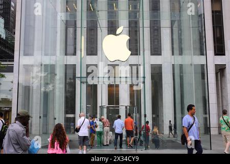 NEW YORK, USA - SEP 08, 2014: Entrance to the largest Apple Store in the form of a glass cube with the company logo Stock Photo