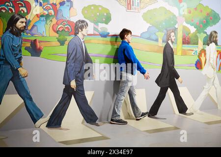 MOSCOW, RUSSIA - MAR 24, 2015: Boy (with model release) poses with Beatles iOptical Illusions Museum at VDNKh. Stock Photo