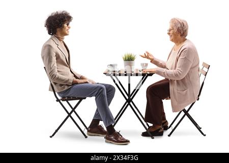 Young man and elderly woman having coffee and talking isolated on white background Stock Photo