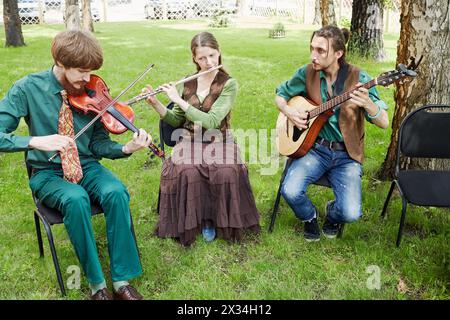 MOSCOW, RUSSIA - MAY 30, 2015: Musical Band Polca an Ri plays music in forest on summer day. Stock Photo