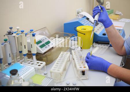 Workplace with automatic pipettes and test tubes with the analysis in the laboratory Stock Photo