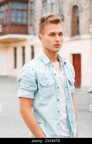 Young Man In Denim Clothes Outdoors Stock Photo
