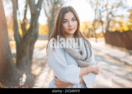 Pretty Woman In Knitted Sweater On The Background Of Autumn Park Stock Photo