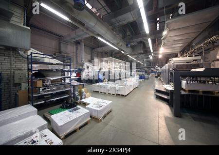 MOSCOW, RUSSIA - NOV 29, 2014: Workshop with working man in Polygraph complex Pushkinskaya Square Stock Photo