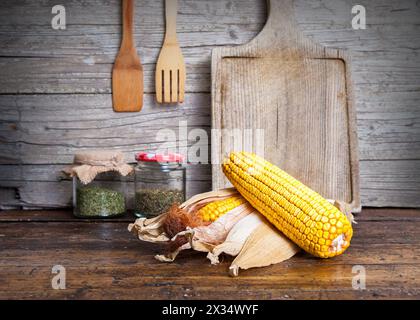 still life of corncobs on rustic wood Stock Photo