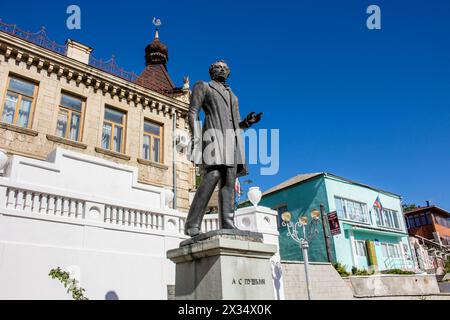 BAKHCHYSARAY, CRIMEA - SEPTEMBER 2014: City streets of Bakhchisaray. Monument to the poet Alexander Pushkin in Bakhchisaray Stock Photo