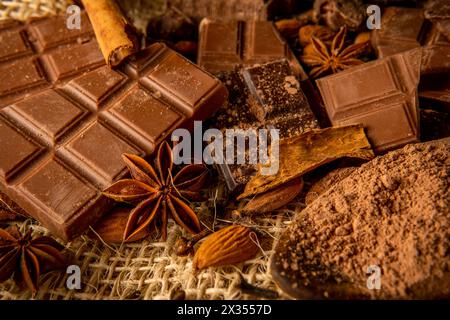 Closeup of various types of chocolate with spices. Background for recipes with chocolate Stock Photo