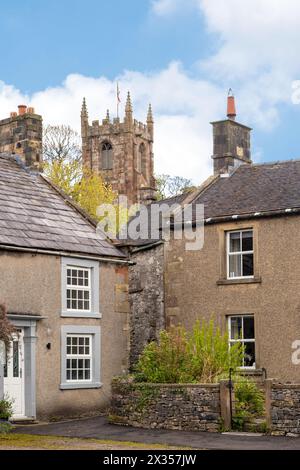 Cottages in the Derbyshire Peak District village of Hartington with the parish church of St. Giles Stock Photo