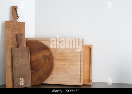Set of wooden kitchen cutting boards on white background Stock Photo