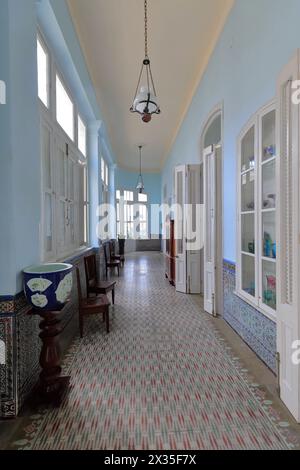 189 Light-blue corridor in the former Palacio Ferrer Palace, now Museo de Artes Museum, colorist tiles on floor and downside walls. Cienfuegos-Cuba. Stock Photo