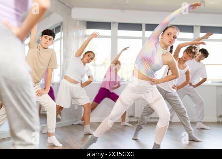 Group of children warming up before dance class Stock Photo