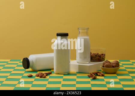 Many types of organic nuts are displayed with three milk bottles. Soybean oil is the vegetable oil extracted from the seeds of the soybean Stock Photo