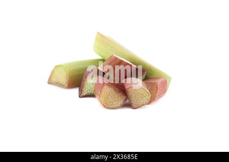 Variety of rhubarb stalks of varying colors from pale green to deep red isolated on white background, health benefits of eating rhubarb Stock Photo