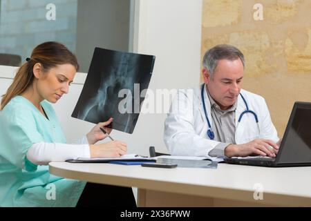 portrait of doctors with xray report in hospital Stock Photo