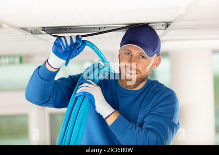 checking air ducts in a home hvac system Stock Photo